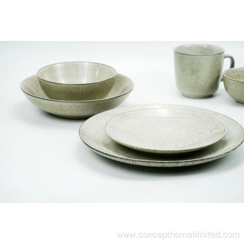 Reactive glazed stoneware dinner set in bluish gray